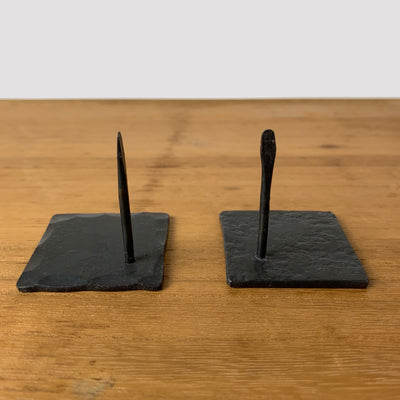 2 styles of square wrought iron mosquito coil holders: hammered edge (left), all over texture (right).