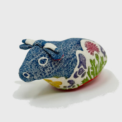 Front view of woodblock print stuffed cow.