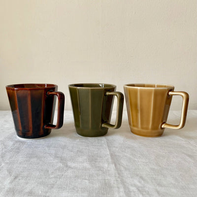 12-sided hasami mugs in chocolate, moss and caramel.