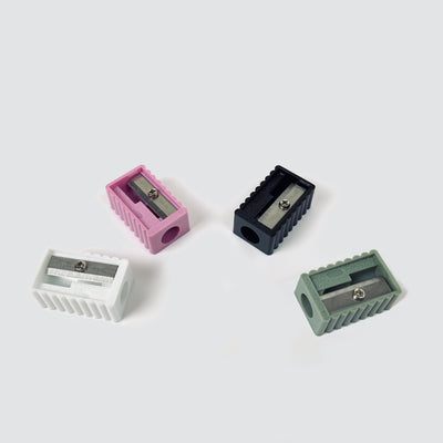 NJK pencil sharpeners No. 508 in 4 colors: (from left) white, pink, black, green.