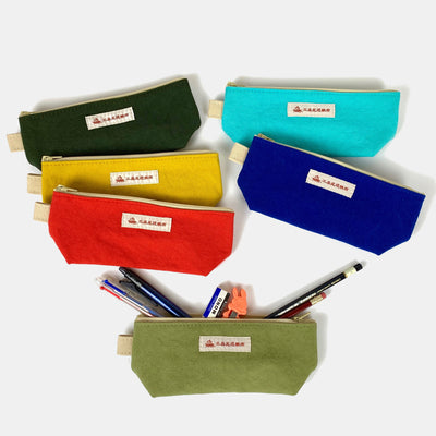 6 canvas pencil cases on display with the bottom (light olive) showing the content (pencils, pens, eraser and pencil sharpener).