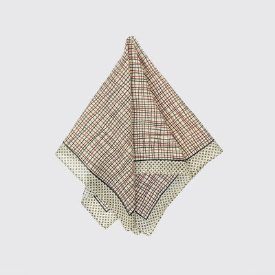 A light bandana - plaid and crosses pulled in the center and splayed.