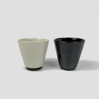 Slim ceramic cups: natural on the left and black on the right.