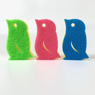 All 3 colors of penguin shaped scrub sponges: (from left) light green, pink, blue.