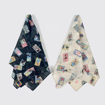 Light bandanas - yokai cards pulled in the center and splayed: black (left) and beige (right).