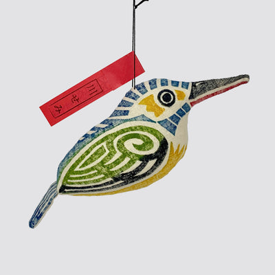 Close up of a woodblock print stuffed kingfisher.