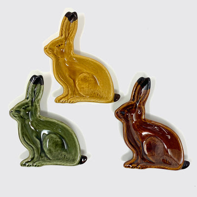 3 colors of rabbit dish: caramel (top), green (bottom left) and dark brown (bottom right)