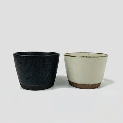 Rustic ceramic cups: charcoal on the left and natural on the right.